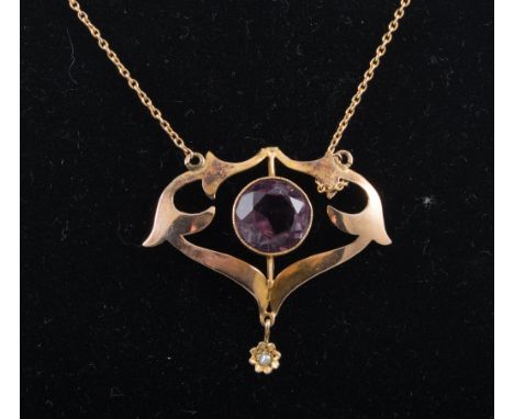 An Edwardian amethyst pendant, the circular faceted stone set to centre of a rose metal mount stamped 9ct with small seed pea