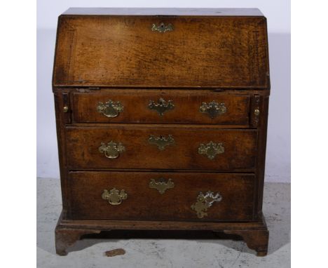 George III oak bureau, fall front, with an interior fitted with drawers and pigeon-holes, three long graduating drawers, brac