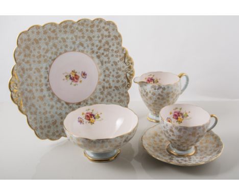 Six-piece Foley tea service, gilt chintz pattern with sprig of spring flowers to centre and interior of cups, circa.1931.
