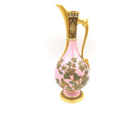 A 19th century porcelain ewer of classical form with hand painted and gilt vine and grape decoration on a pink ground, in the