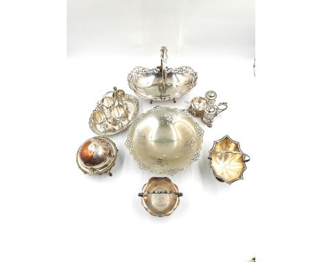 A collection of silver plate to include a Mappin and Webb footed dish with swing handle, a footed bowl, an egg cup set, devil