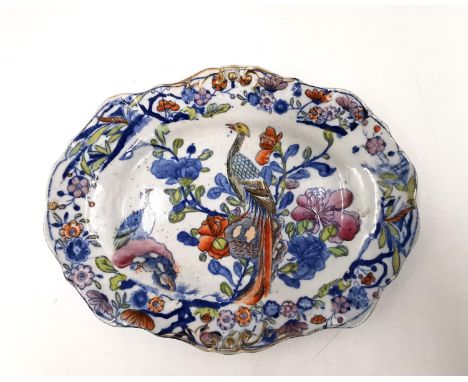 An early 19th century miniature Ironstone platter, with marks in underglaze blue to the base. L.17 W.13.4cm