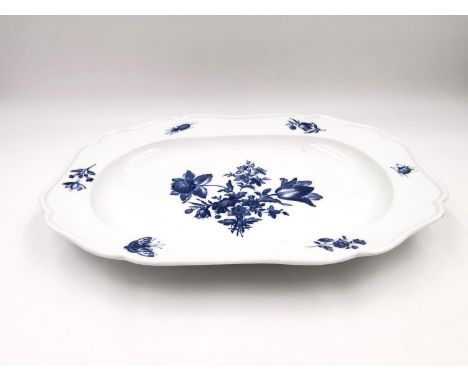 A 19th century blue and white Meissen platter with a central floral design with insects and sprigs of flowers to the border. 