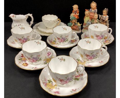 Six Royal Crown Derby ‘Derby Posie’ tea cups and saucers conforming milk jug; a group of six Hummel Goebel figures 
