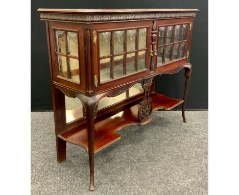 An Edwardian Vitrine cabinet, carved frieze, glazed doors and sides with domed glass panels, carved cabriole legs with shaped