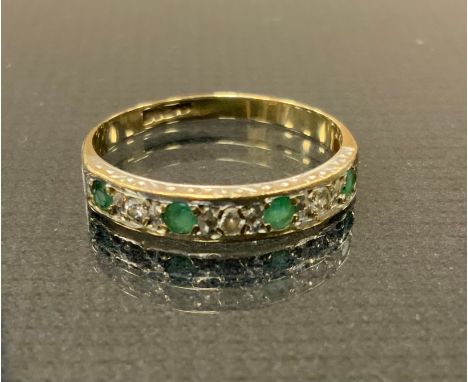 A diamond and emerald half eternity ring, alternate set with four emeralds and three three round brilliant cut diamonds, 9ct 