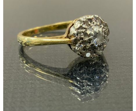 A diaamond cluster ring, set with nine round brilliant cut diamonds , yellow metal shank, stamped 18ct, size L, 2.9g gross 