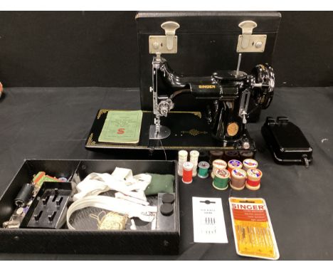 A Singer sewing machine, model 221KI, in case, with instruction manual, manufacture number EF564991 for 1949 