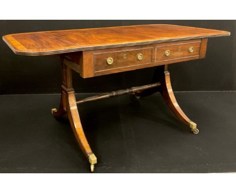 A George III mahogany sofa table; crossbanded rounded rectangular top above a pair of drawers to frieze, faux drawers to oppo