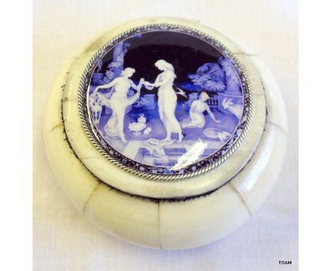 A bone circular lidded box with enamel panel