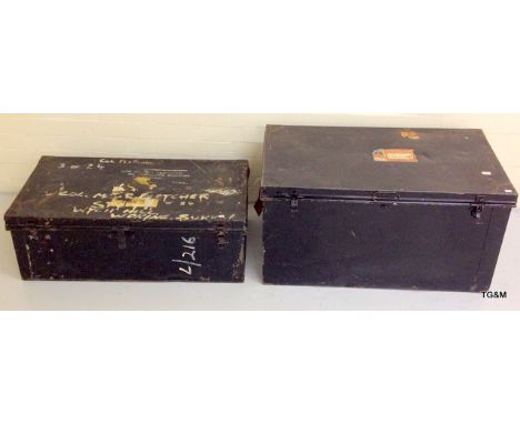 A very large tin trunk and smaller similar trunk