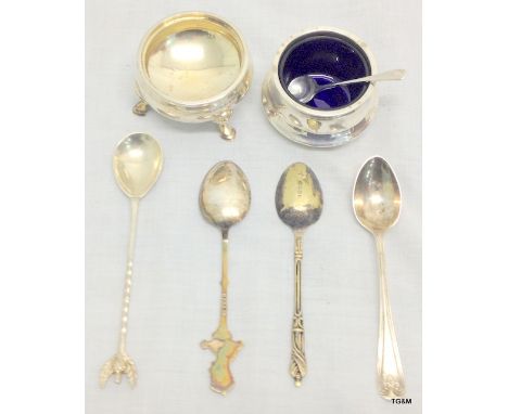 Hallmarked silver open salt with blue glass liner, silver open salt on tripod legs, and other silver & silverplate items.