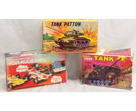 A Lois Marx firing tank and 2 other toys all boxed