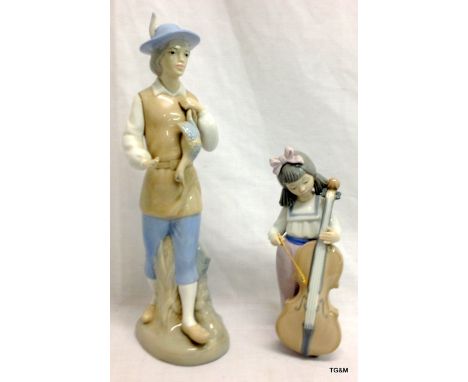 A Nao girl with cello and a Valencia Spanish peasant with bird figurine