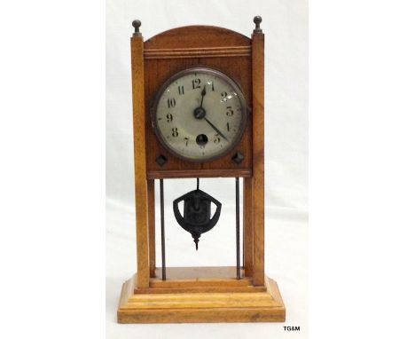 A small Arts and Craft mantel clock