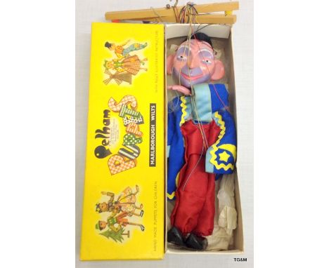 A vintage Pelham puppet of a Jester in an original box