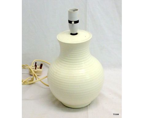 An unusual white glazed Moorcroft Pottery table lamp with marks to the base 25cm high