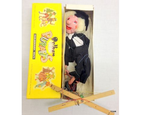 A vintage pelham puppet of a wizard in original box