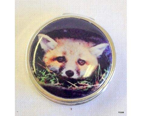 A silver and enamel pill box with pictorial image of a fox