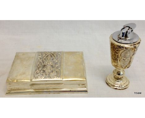 A stirling silver cigarette box and matching table lighter