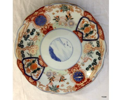 An Oriental porcelain plate with Imari colours enamel decoration