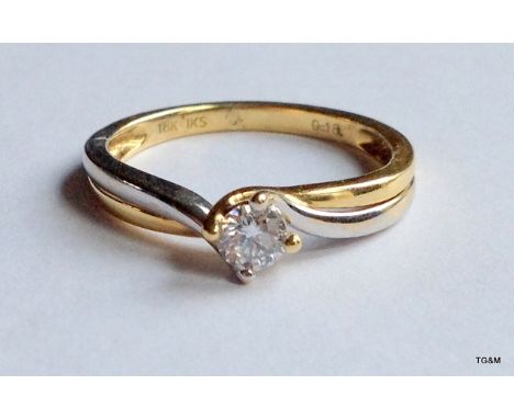 An 18ct white and yellow gold diamond solitaire 0.25ct size k