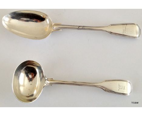 A silver ladle hallmarked London 1843 and silver serving spoon hallmarked London 1860