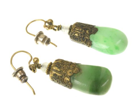 A pair of jade ear pendantsThe jade drop suspended from gilt metal filigree caps to a hook, length 3.7cm