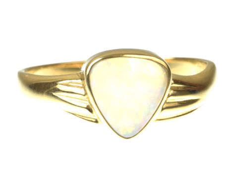 An opal single stone ringThe triangular shape opal cabochon, with reeded shoulders, to an 18k gold mount, ring size L   CONDI