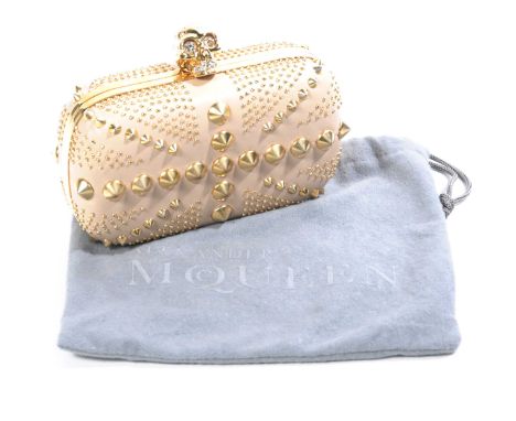 An Alexander Queen 'Britannia skull' clutch bagThe small box clutch, with light pink leather exterior, adorned with gilt meta