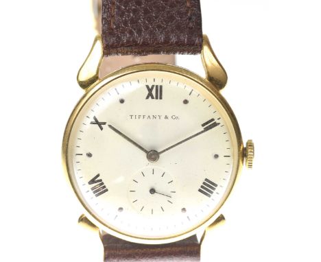 Tiffany & Co.: A gold plated manual wind wristwatchThe signed white dial with alternating Roman numeral and dot hour markers,