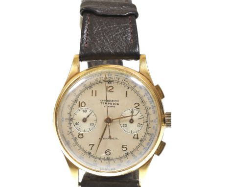 A gentleman's 18k gold manual wind chronograph wristwatchThe champagne coloured dial with applied gold Arabic hour markers, t