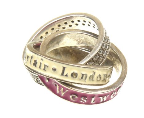 Vivienne Westwood: A Mayfair puzzle ringThe three bands decorated with fuschia pink and cream enamel with text, another band 