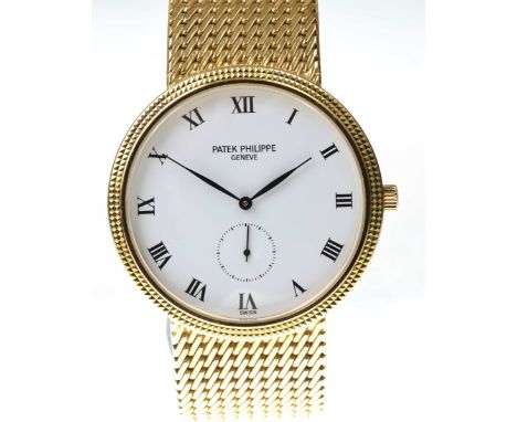 Patek Philippe: A fine gentleman's 18k gold Calatrava bracelet watchThe white dial with black Roman numeral hour markers, the