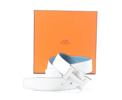 A Hermes 'Epsom' reversible leather belt The white and blue leather belt, with exposed stitching, and embossed marks, with si