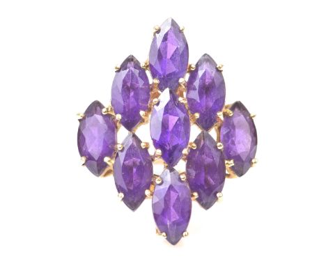 An amethyst dress ringThe marquise shape amethysts in a lozenge cluster, to an 18k gold shank, ring size N½