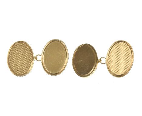 A pair of 9k gold cufflinksThe oval panels, one plain, with engine turned decoration, chain connectors, cased, weight combine