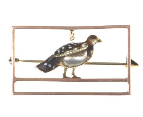 A Victorian novelty broochThe enamel partridge set with a pearl, to a precious yellow metal rectangular frame, stamped 9ct, w