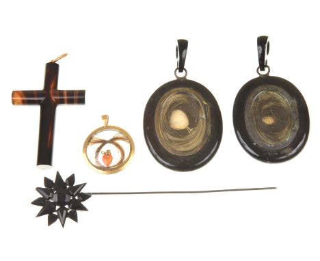 A collection of Victorian mourning jewelleryTo include; a banded agate cross pendant, two black glass lockets with glazed com