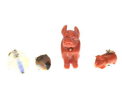 A coral pig charmTogether with, a carved coral bull dog charm, an opal matrix charm and an opal and faceted rock crystal char