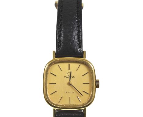 Omega: A ladies manual wind wristwatchThe signed gold dial with applied black and gold hour markers, the 18k gold shaped squa