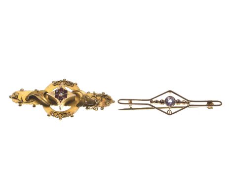 A late Victorian gem-set broochCentering a gem cluster within a circular surround, flanked by scrolls, in 9k gold, with a saf