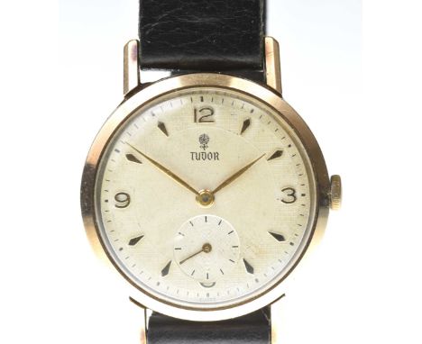 Tudor: A 9k gold manual wind wristwatchThe white textured dial with applied gold quarterly hour markers and baton hour marker