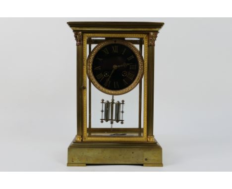 A French crystal regulator 4-glass brass and glass mantel clock with four bevelled glass panes, opening door front and rear, 