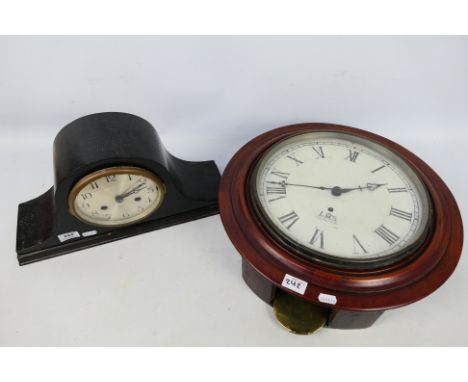 A good lot of two clocks to include a dark cased, Napoleon hat styled mantel clock with gong striking movement together with 