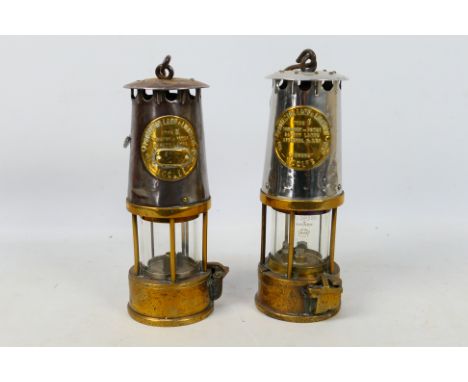 Two Eccles Protector Lamp &amp; Lighting Company Ltd safety lamps comprising a type SL and a type 6, both with hook handles, 