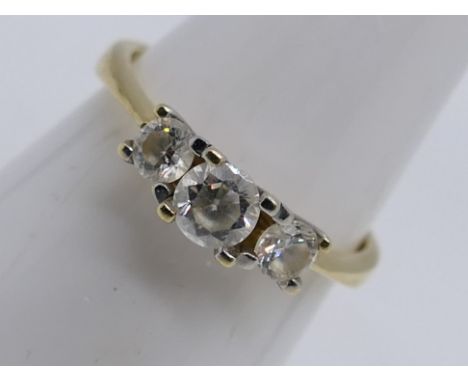 A 14 carat yellow gold ring set with three diamonds, size O, approx 3.29 gm (all in)