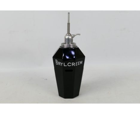 A vintage octagonal section, amethyst glass, Brylcreem dispenser, 27 cm (h).Condition Report: Very good condition overall, no