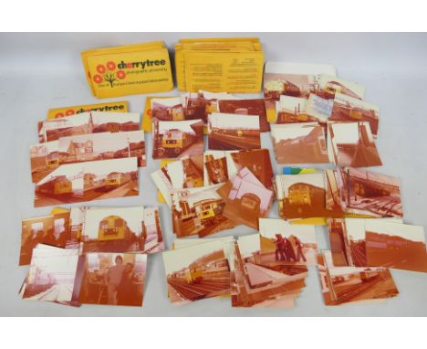 A collection of vintage photographs, railway / train related, with notations verso.Condition Report: The photograph packets d