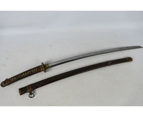 A vintage katana with 68 cm blade, floral decorated tsuba and fuchi, contained in brown lacquered metal saya, 100 cm (l) over